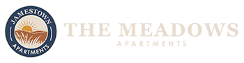 The Meadows Apartments logo with a sun and wheat design.